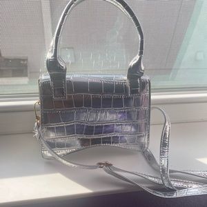 Silver purse never used still brand new